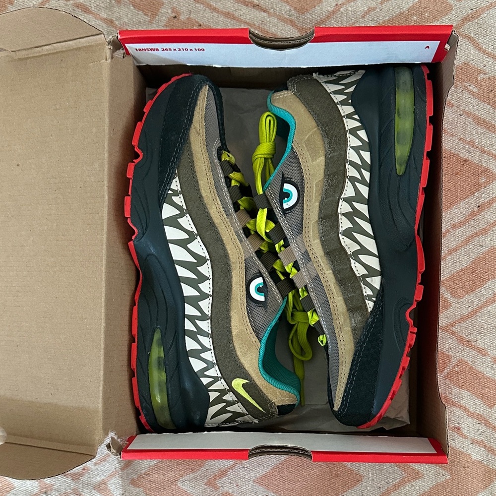 Nike Kids Sneakers with Black, Brown, and Green Accents